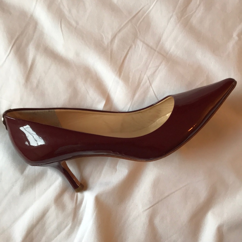 Red patent leather pumps